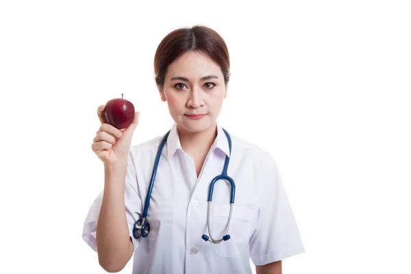 Young Asian female doctor show an apple. — Stock Photo, Image