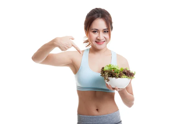 Schöne asiatische gesunde Mädchen zeigen auf Salat. — Stockfoto