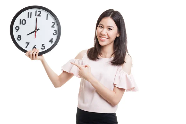 Young Asian business woman point to a clock. — Stock Photo, Image