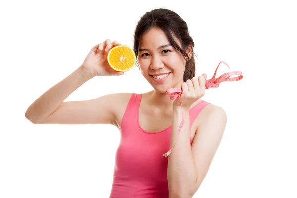 Asian healthy girl on diet with orange fruit and measuring tape. — Stock Photo, Image