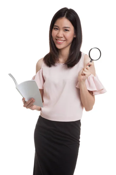 Asian business woman with a book and magnifying glass. — Stock Photo, Image
