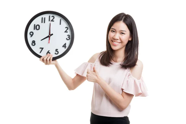 Young Asian business woman thumbs up with a clock. — Stock Photo, Image