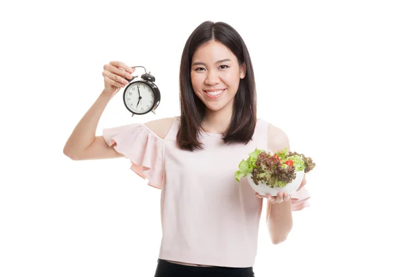 Mladé asijské ženy s hodinami a salátem. — Stock fotografie