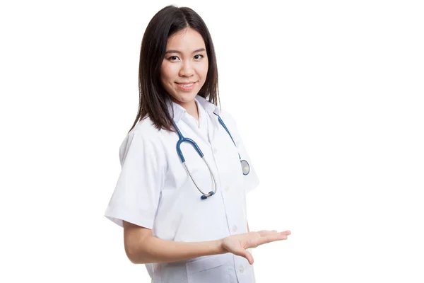 Asian young female doctor present something on her left. — Stock Photo, Image