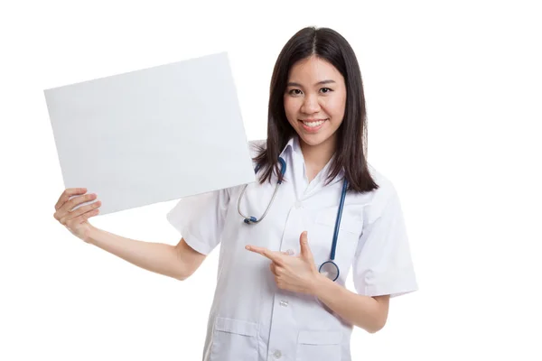Young Asian female doctor point to a blank sign. — Stock Photo, Image