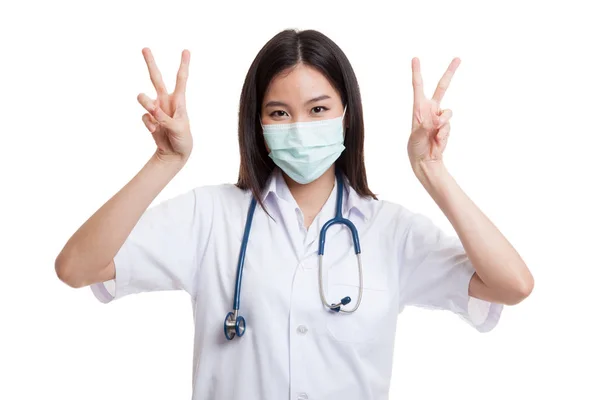 Young Asian female doctor show victory sign with both hands. — Stock Photo, Image