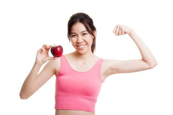 Schön asiatische gesunde Mädchen Biegen Bizeps mit Apfel. — Stockfoto