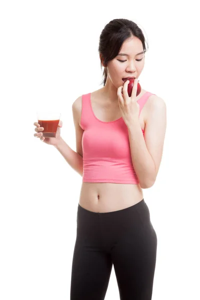 Beautiful healthy Asian girl with tomato juice and apple. — Stock Photo, Image