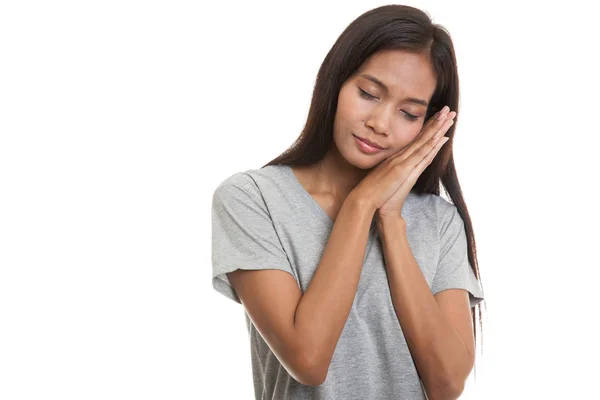 Beautiful young Asian woman with sleeping gesture. — Stock Photo, Image