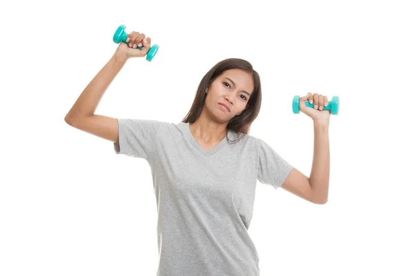 Exhausted Asian woman with dumbbells. — Stock Photo, Image