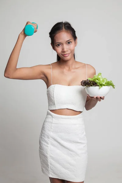 Healthy Asian woman with dumbbells and salad. — Stock Photo, Image