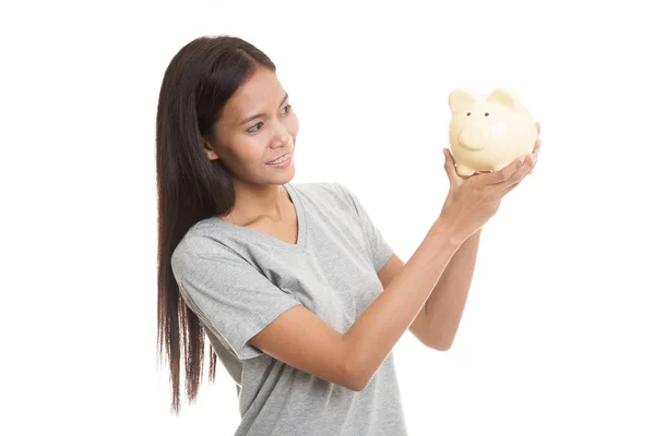 Bir domuz para banka ile genç Asyalı kadın. — Stok fotoğraf