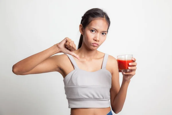 Asiatique femme pouces vers le bas haine tomate jus . — Photo
