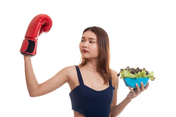 Young Asian woman with boxing glove and salad. — Stock Photo, Image