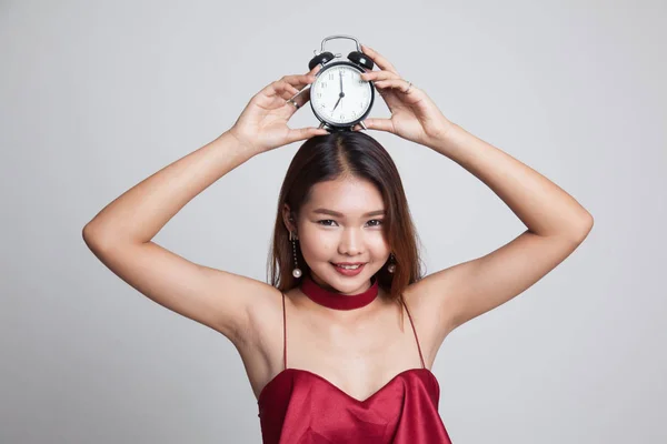 Joven asiática sonrisa con un reloj . —  Fotos de Stock