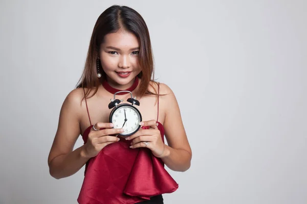 Joven asiática sonrisa con un reloj . —  Fotos de Stock