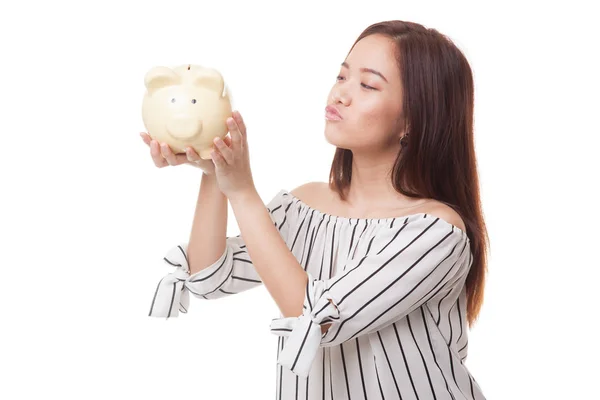 Young Asian woman kiss  a pink coin bank. — Stock Photo, Image