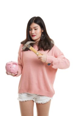 Asyalı kadın domuz para banka ve çekiç ile.