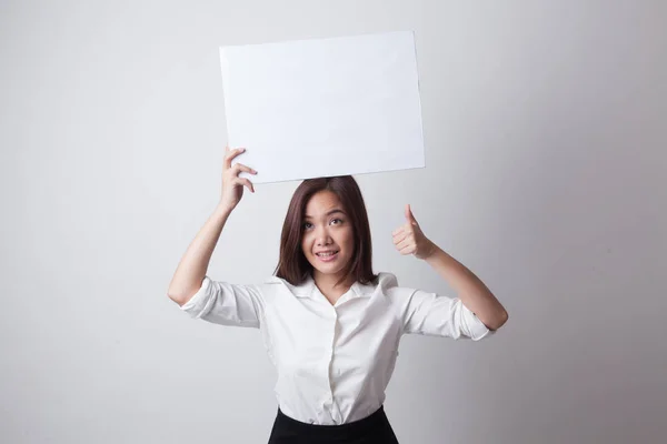 Young Asian woman show thumbs up with white blank sign. — Stock Photo, Image