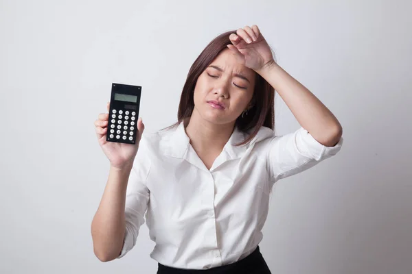 Asian woman got  headache with calculator. — Stock Photo, Image
