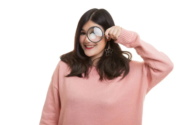 Young Asian woman with a magnifying glass. — Stock Photo, Image