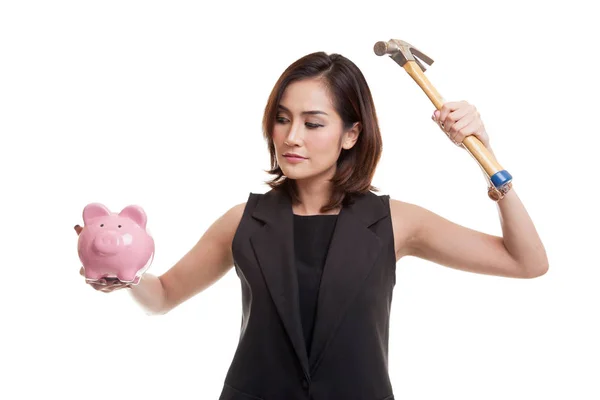 Asian woman with pig coin bank and hammer. — Stock Photo, Image