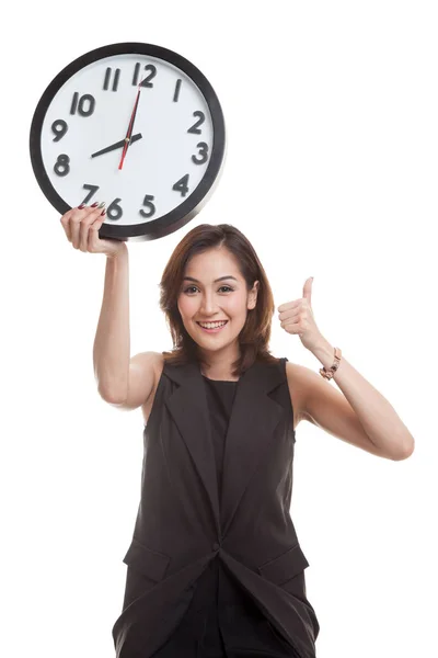 Young Asian business woman thumbs up with a clock. — Stock Photo, Image