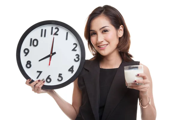 Healthy Asian woman drinking  glass of milk hold clock. — Stock Photo, Image