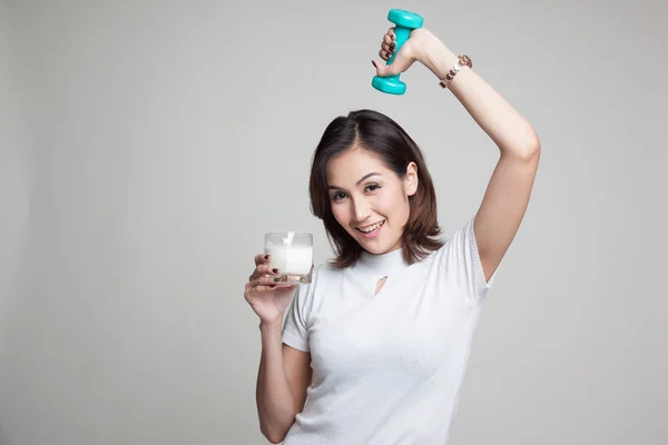 Healthy Asian woman drinking a glass of milk and dumbbell. — Stock Photo, Image