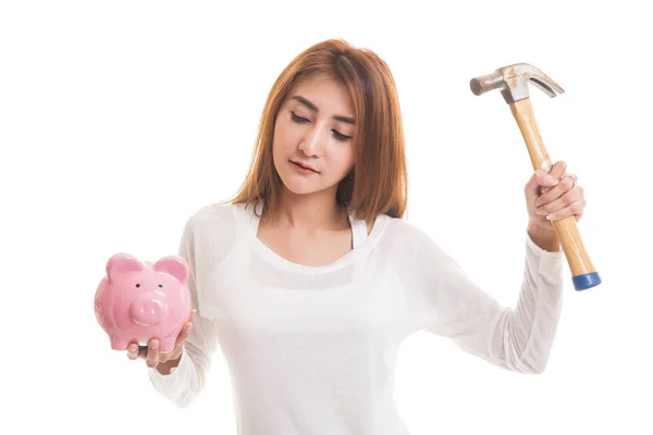 Asian woman with pig coin bank and hammer. — Stock Photo, Image