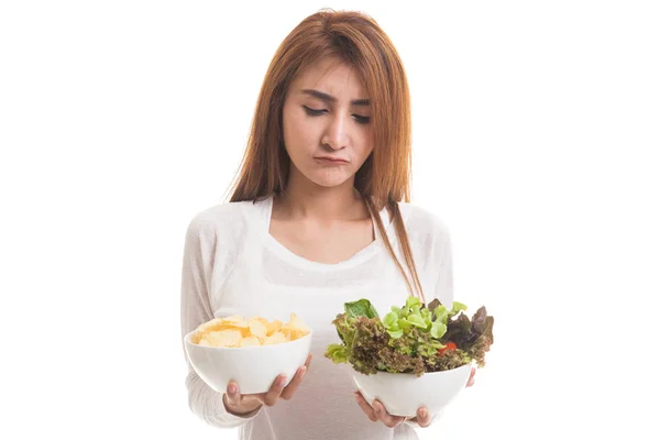 Young Asian woman with potato chips and salad. — Stock Photo, Image