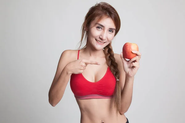 Vacker asiatisk friska flicka punkt till apple. — Stockfoto