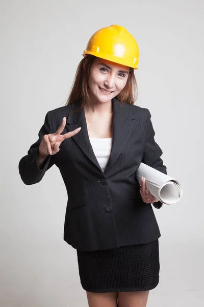 Asian engineer woman with blueprints show victory sign. — Stock Photo, Image