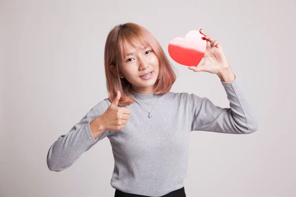 Asian woman thumbs up with red heart. — Stock Photo, Image