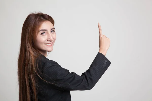 Rücken einer asiatischen Frau, die den Bildschirm mit ihrem Finger berührt. — Stockfoto