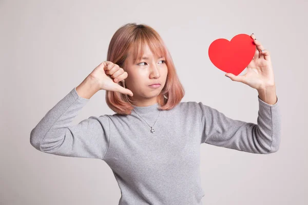 Asian woman thumbs down with red heart. — Stock Photo, Image