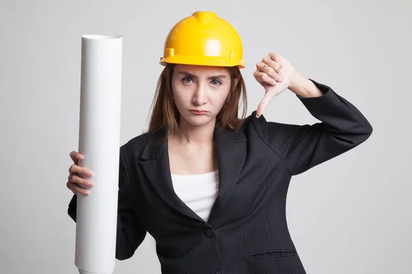 Asian engineer woman thumbs down with blueprints. — Stock Photo, Image