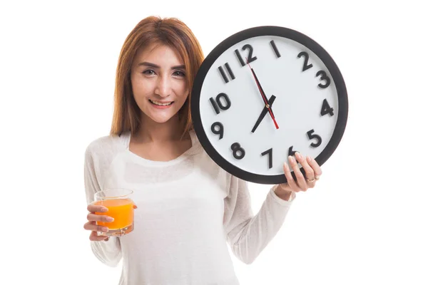 Mujer asiática con un reloj beber jugo de naranja . —  Fotos de Stock