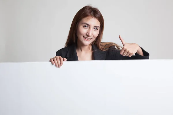 Young Asian woman show thumbs up with blank sign. — Stock Photo, Image