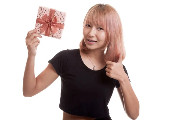 Young Asian woman thumbs up with a gift box. — Stock Photo, Image