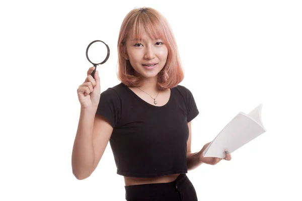 Asian woman with a book and magnifying glass. — Stock Photo, Image