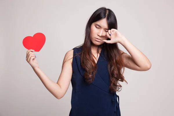Asian woman sad and cry with red heart.