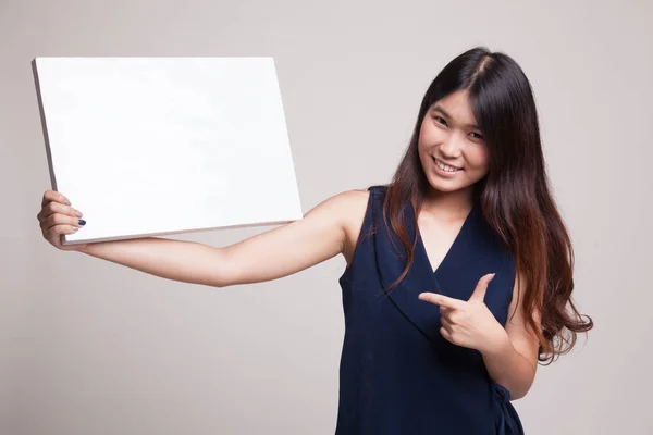 Young Asian woman point to  blank sign. — Stock Photo, Image