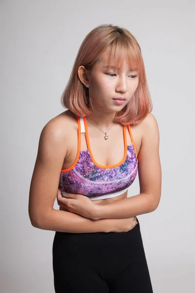 Ázsiai egészséges lány van stomachache. — Stock Fotó