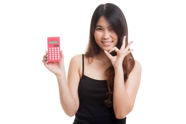 Asian woman show OK with calculator. — Stock Photo, Image