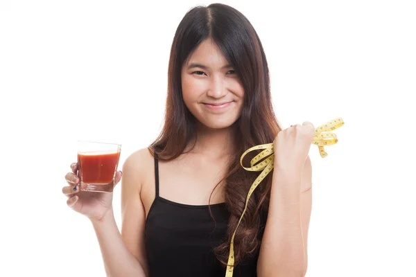 Azjatyckie kobiety z soku pomidorowego i taśma pomiarowa. — Zdjęcie stockowe