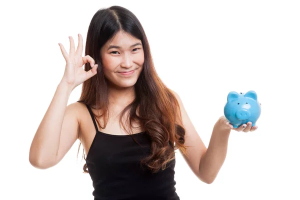 Asian woman show OK  with pig coin bank. — Stock Photo, Image