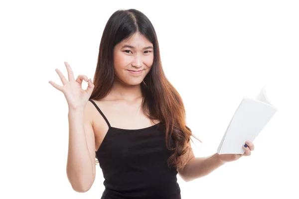 Young Asian woman show OK with a book. — Stock Photo, Image