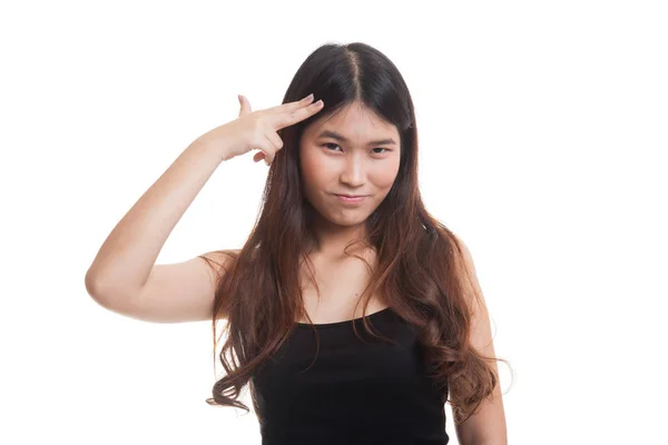 Beautiful young Asian woman holding fingers in gun gesture. — Stock Photo, Image
