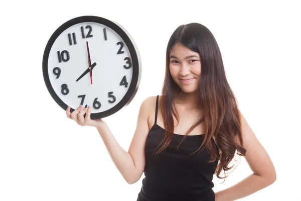 Young Asian woman with a clock. — Stock Photo, Image